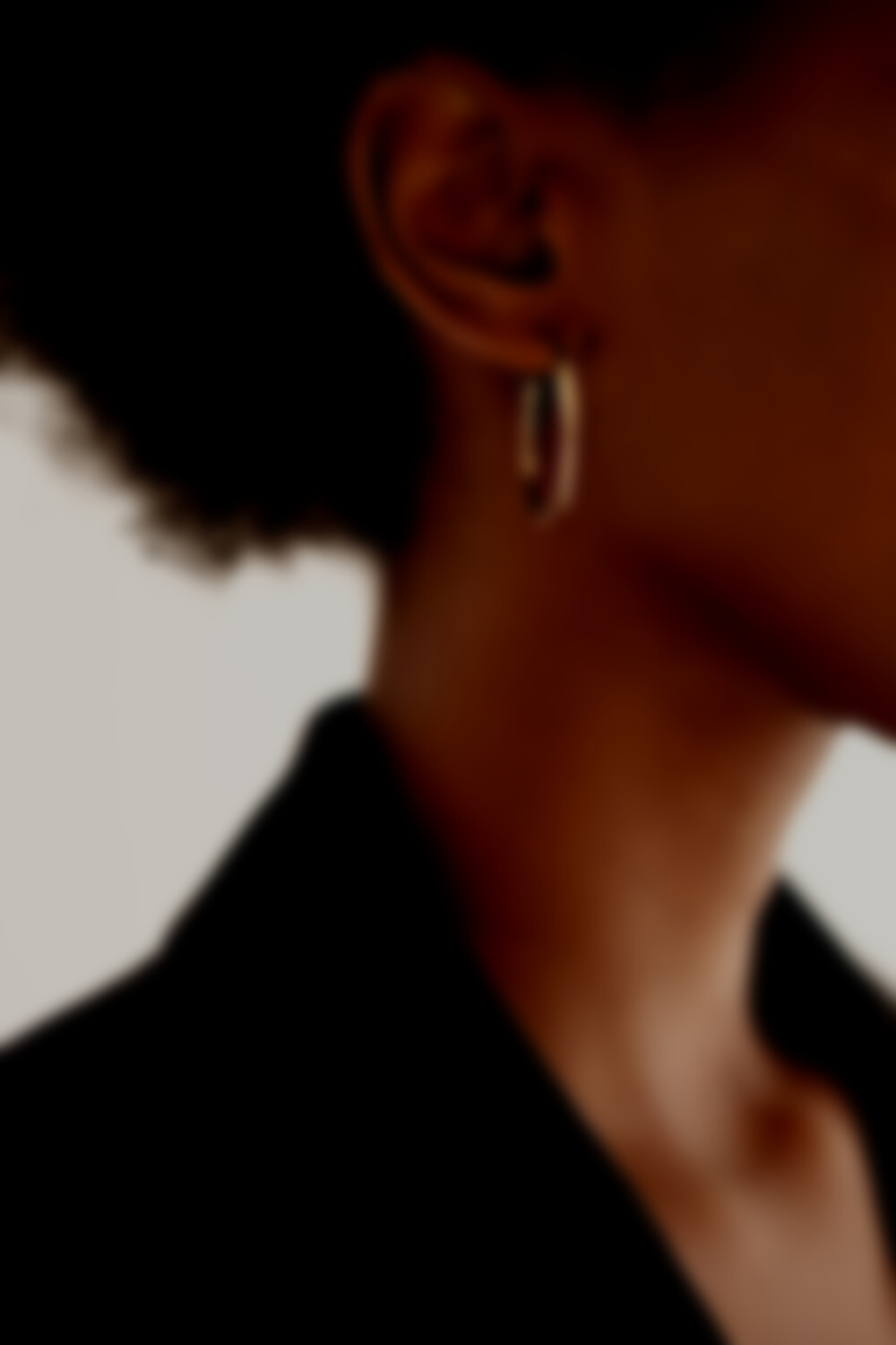 Woman with Minimalist Earrings