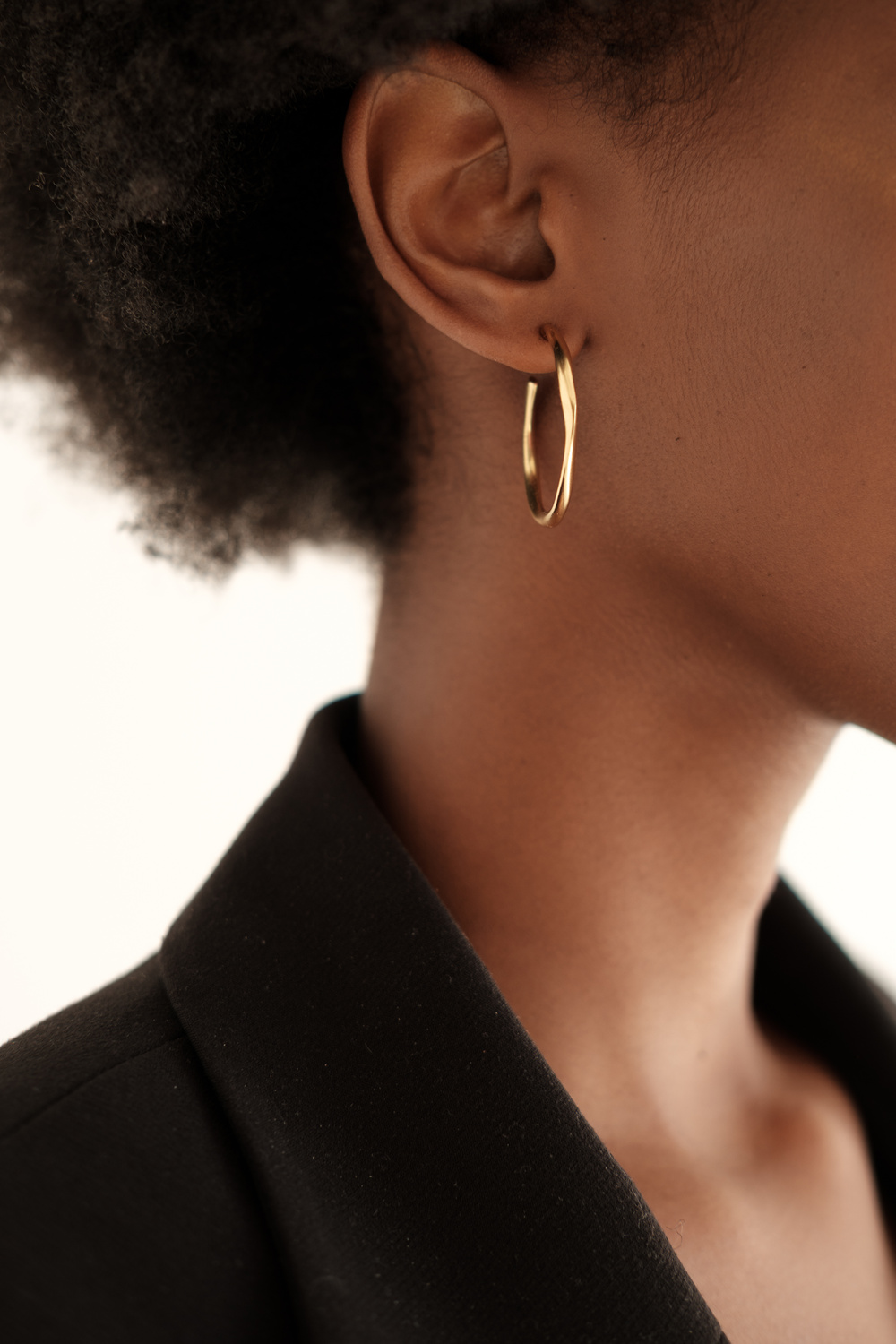 Woman with Minimalist Earrings