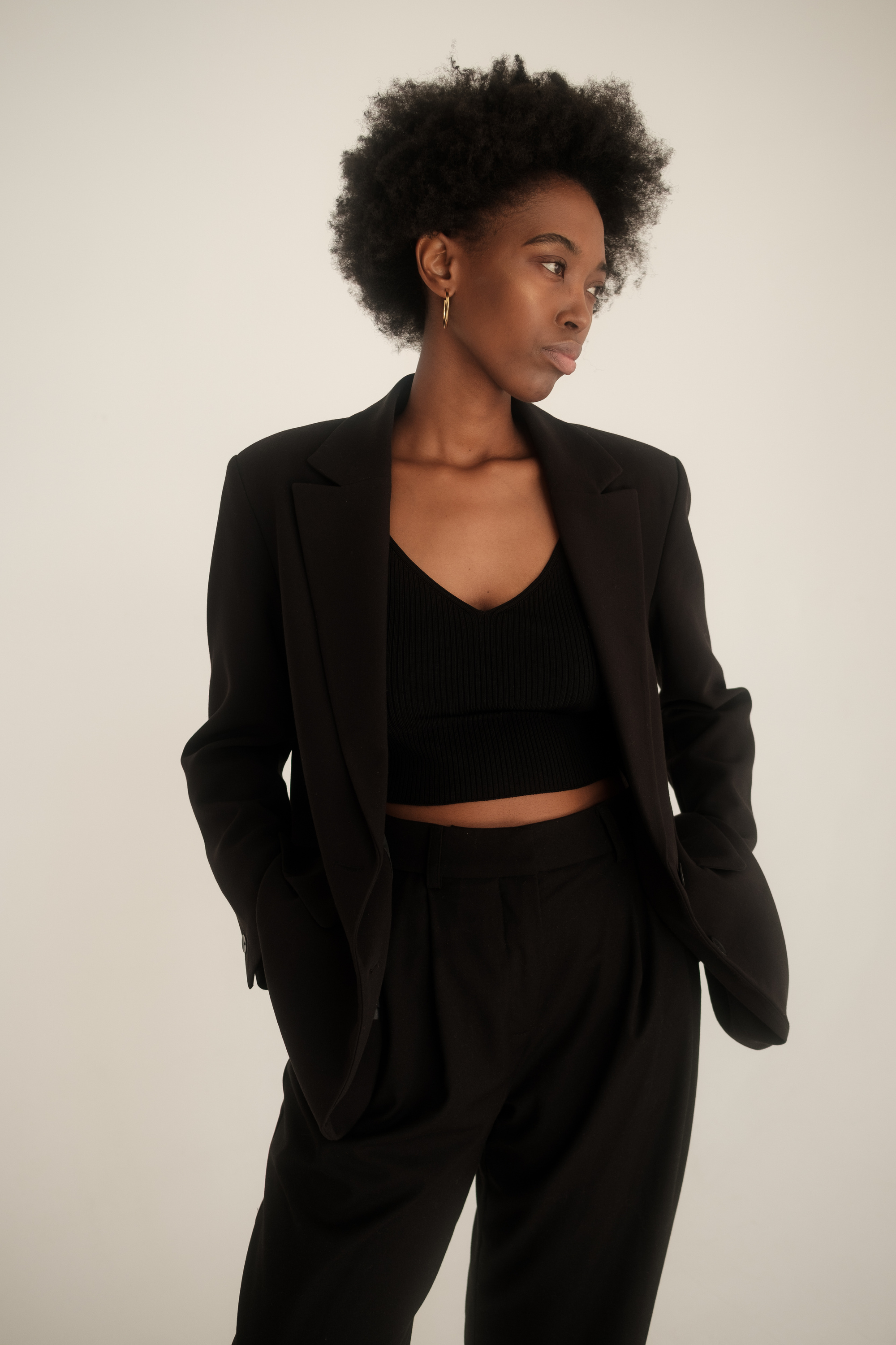 Woman in Black Blazer and Crop Top
